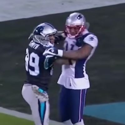 Aqib Talib and Steve Smith are pushing each other in the picture.